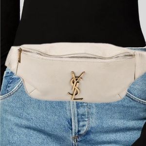 Saint Laurent Belt Bag
Neutrals Leather
Gold-Tone Hardware
Adjustable Waist